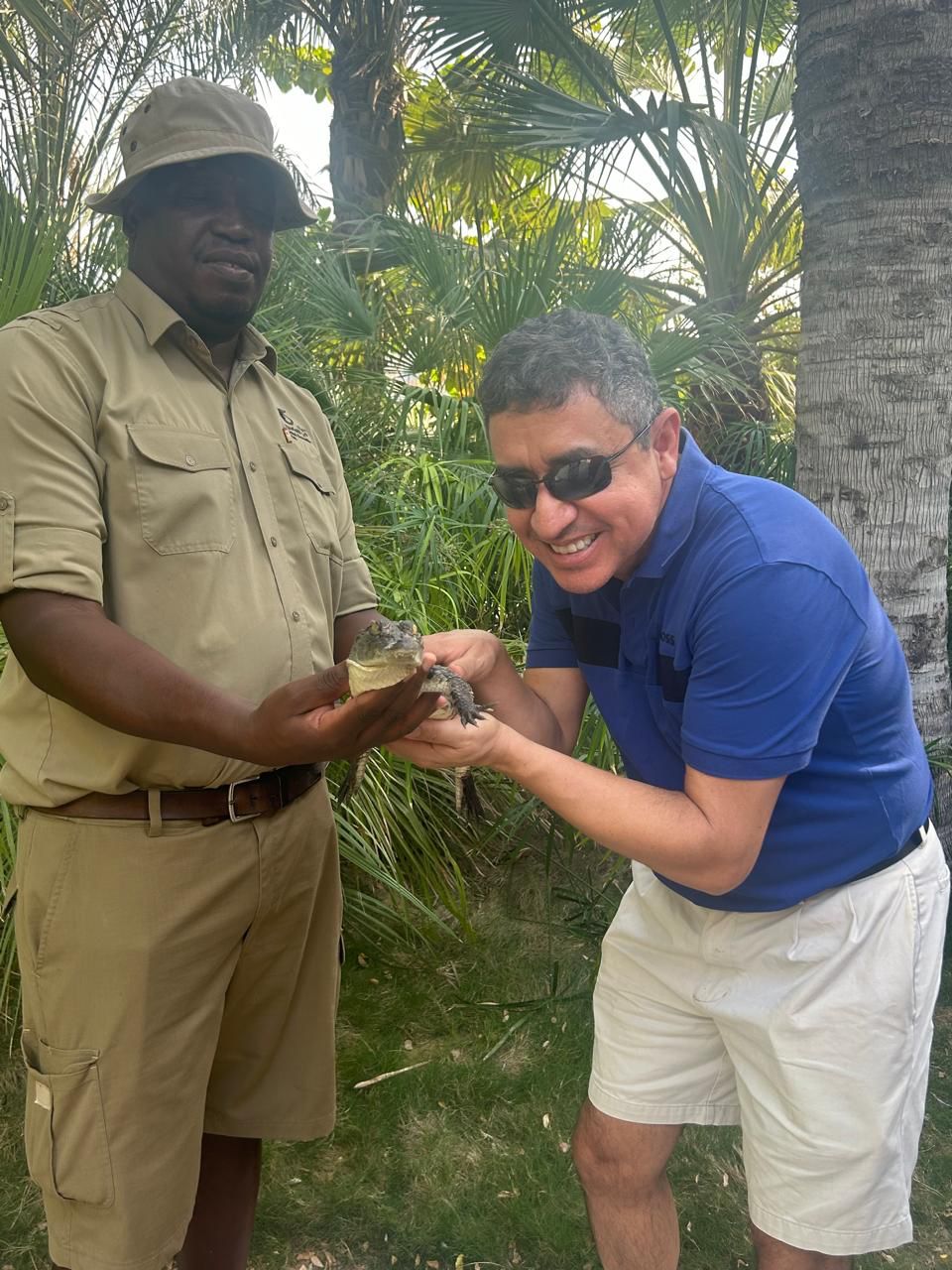 Francisco Rodríguez-Henríquez holding a baby crocodile
